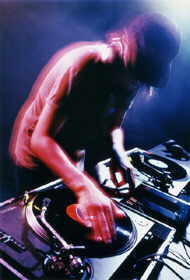 A DJ spinning a disc.